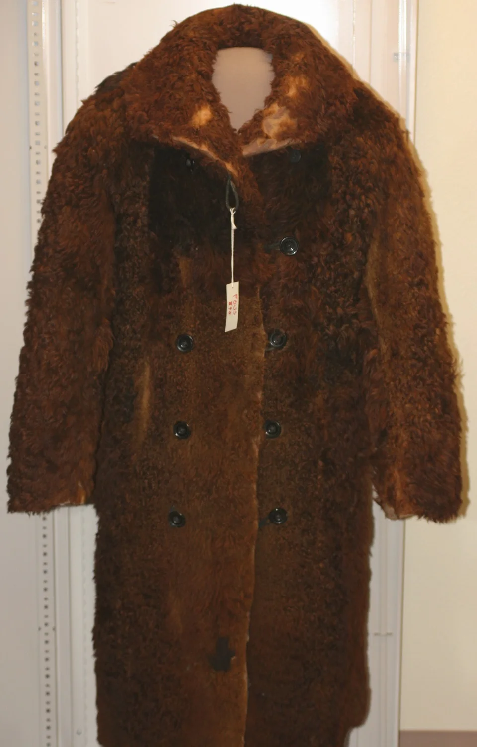 Buffalo robe coat.
During the fur trade, on average about 25,000 buffalo robes were sent down river each year to the major commercial centers. The robes were then used as blankets, padding in carriages and made into buffalo coats like the one pictured here.
(received as gift)
Keywords: fort; union; trading; post; national; historic; site; artifacts; trade; plains; indians; american; artifact